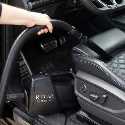 Riccar SupraQuik being used to vacuum a car interior