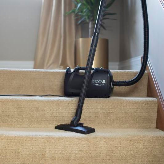 Riccar SupraQuik portable canister vacuum cleaning carpeted stairs