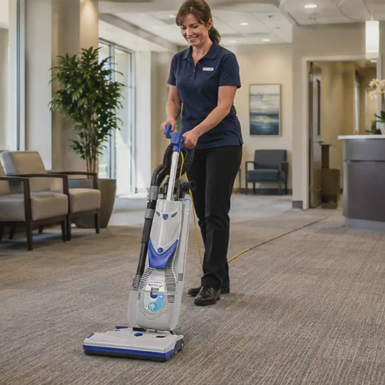 Video of a janitorial staff member using the Lindhaus RX HEPA Eco Force 380E commercial upright vacuum in an office lobby